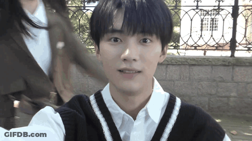 Young Man In White Shirt And Black Vest Selfie GIF