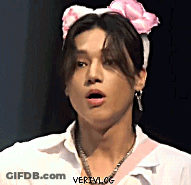 Young Man In White Shirt And Pink Headband With Bow GIF