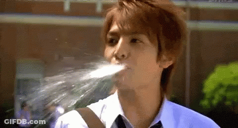 Young Man In White Shirt And Tie Drinking Water GIF