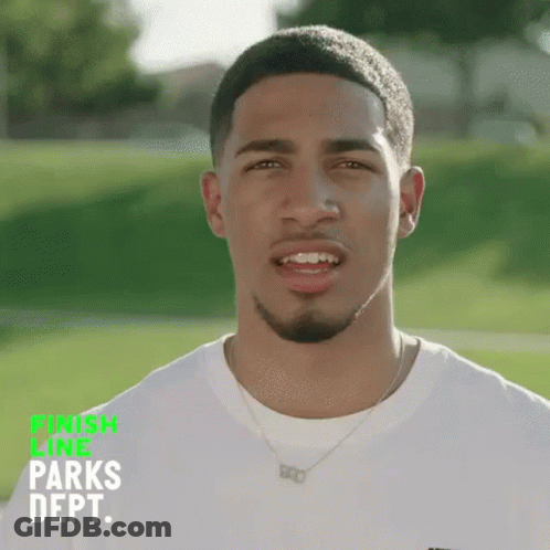 Young Man In White Shirt In Green Field GIF