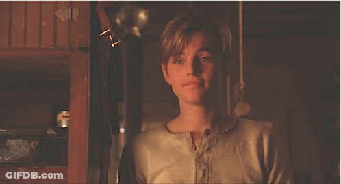 Young Man In White Shirt Looking At Camera GIF