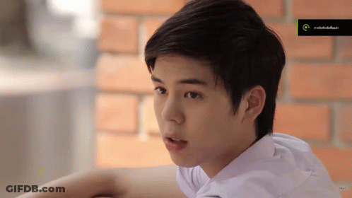 Young Man In White Shirt Looking GIF