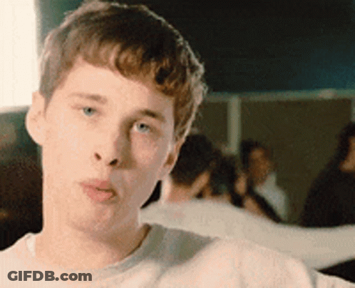 Young Man In White Shirt Making A Face GIF