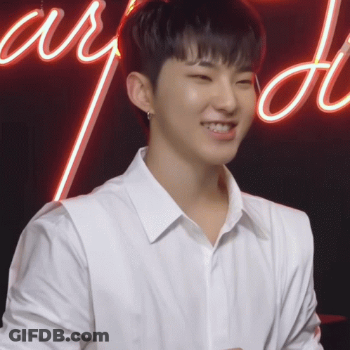 Young Man In White Shirt Smiling Neon Adore GIF