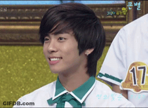 Young Man In White Shirt With Green Collar And Number 17 GIF