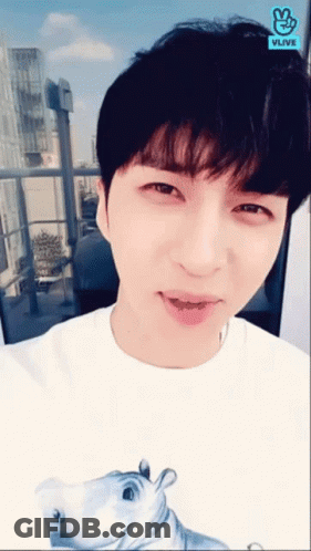 Young Man In White Shirt With Hippo And Vlive Logo GIF
