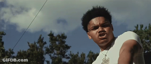 Young Man In White Shirt With Necklace Letter T GIF
