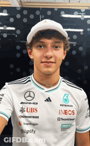 Young Man In White Shirt With UBS And INEOS GIF