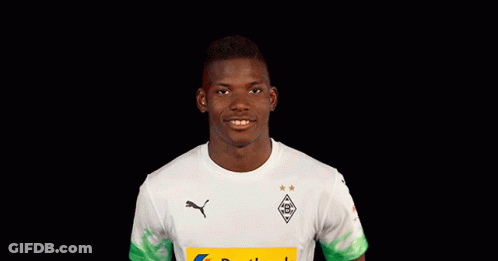 Young Man In White Shirt With Yellow Postbank Logo GIF