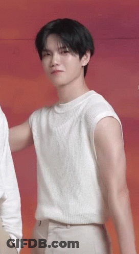 Young Man In White Sleeveless Sweater Next To Man GIF