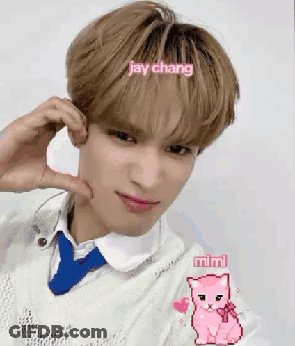 Young Man In White Sweater And Blue Tie Making Heart GIF