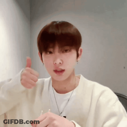 Young Man In White Sweater Thumbs Up GIF