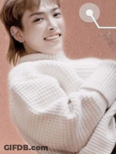 Young Man In White Sweater With Mullet Smiling GIF