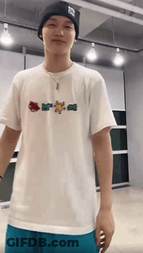 Young Man In White T-Shirt And Black Beanie GIF