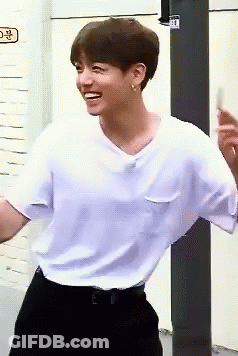Young Man In White T-Shirt And Black Pants GIF