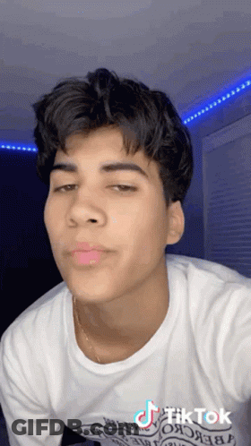 Young Man In White T-Shirt And Gold Chain Taking Selfie GIF