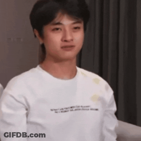 Young Man In White T-Shirt Making Funny Face GIF
