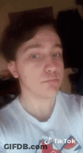 Young Man In White T-Shirt With TikTok Logo GIF