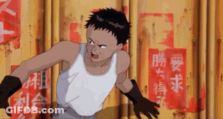 Young Man In White Tank Top And Black Gloves In Front Of Yellow Wall With Chinese Writing GIF