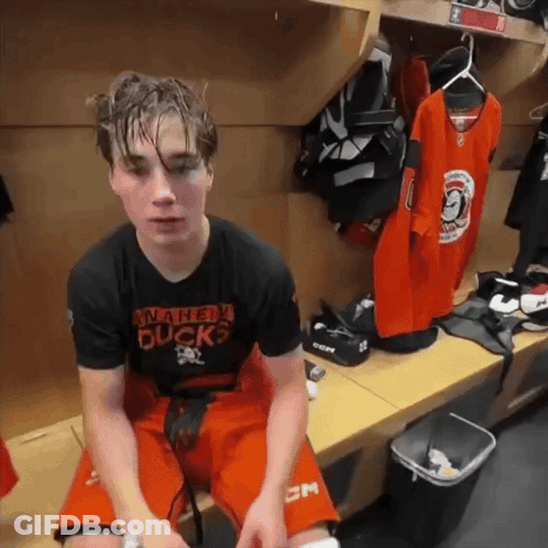 Young Man In Winnipeg Ducks Shirt In Locker Room GIF
