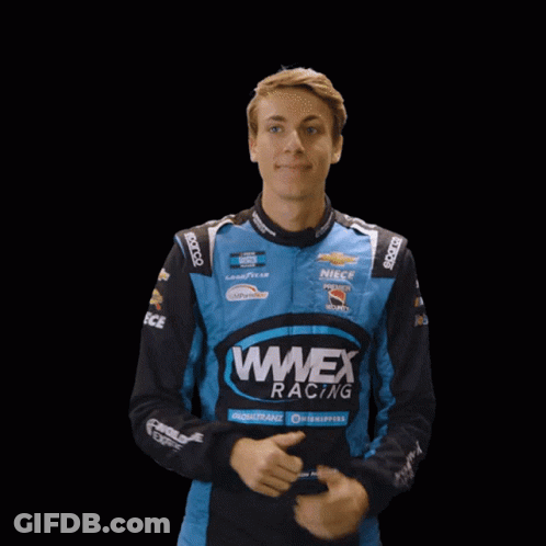 Young Man In Wmex Racing Jacket Giving Thumbs Up GIF