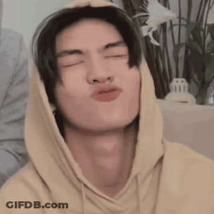 Young Man In Yellow Hoodie Making Funny Face GIF