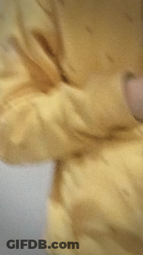Young Man In Yellow Hoodie Taking Selfie GIF