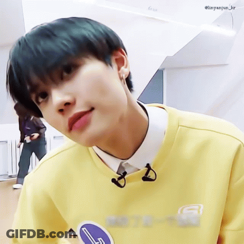 Young Man In Yellow Sweater And White Shirt GIF