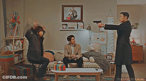 Young Man In Yellow Sweatshirt And Yellow Bag Pointing GIF