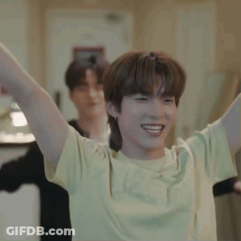 Young Man In Yellow T-Shirt Raising Arms GIF