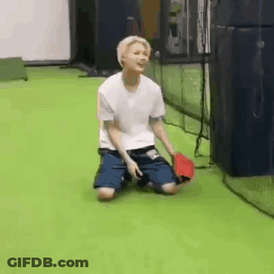 Young Man Kneeling With Baseball Bat GIF