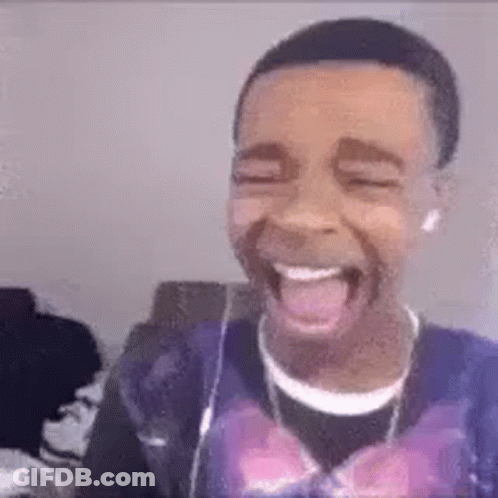 Young Man Laughing And Tongue Out With Headphones GIF