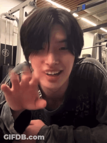 Young Man Laying On Floor In Front Of Gym Machine With Letter G GIF