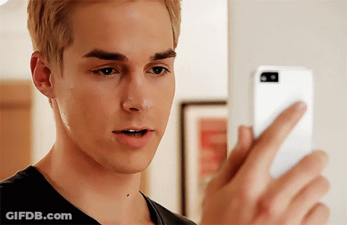 Young Man Looking At Cell Phone GIF