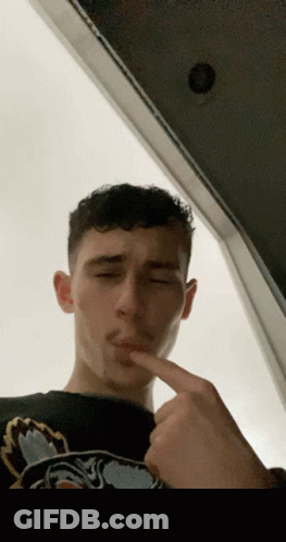 Young Man Making Face Wearing Tiger Shirt GIF