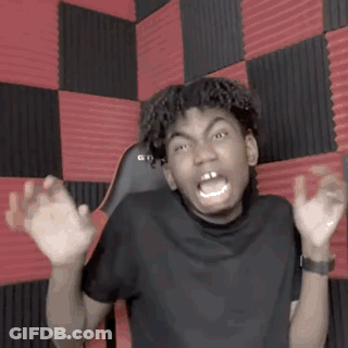 Young Man Making Funny Face At Red And Black Checkered Wall GIF