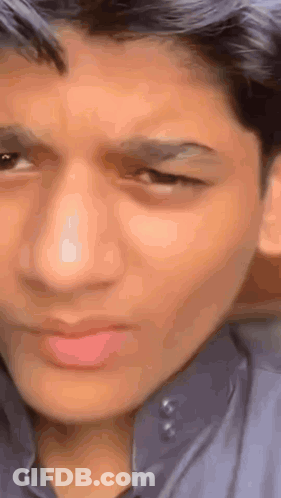 Young Man Making Funny Face Eyes Closed GIF