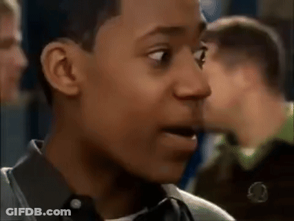 Young Man Making Funny Face In Crowd GIF
