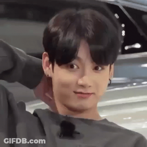 Young Man Making Funny Face Next To Car GIF