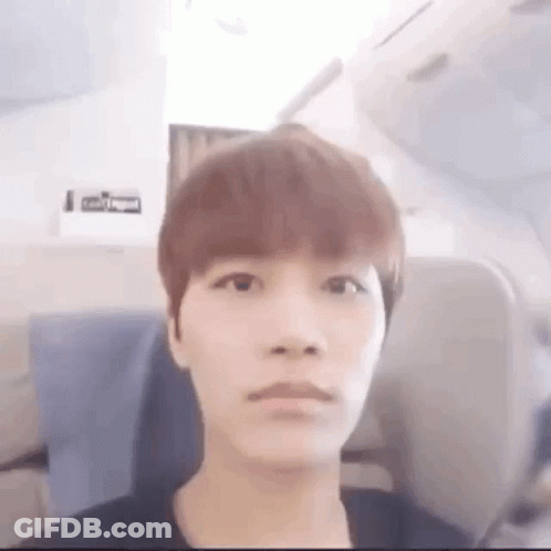 Young Man Making Funny Face On Airplane GIF