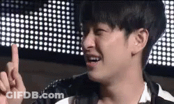 Young Man Making Funny Face Pointing At Camera GIF