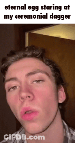 Young Man Making Funny Face With Eternal Egg Caption GIF