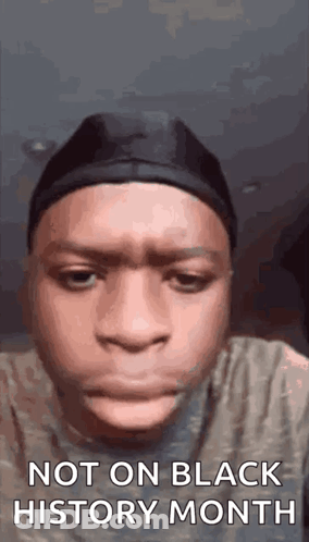 Young Man Making Funny Face With Hat And Headband GIF