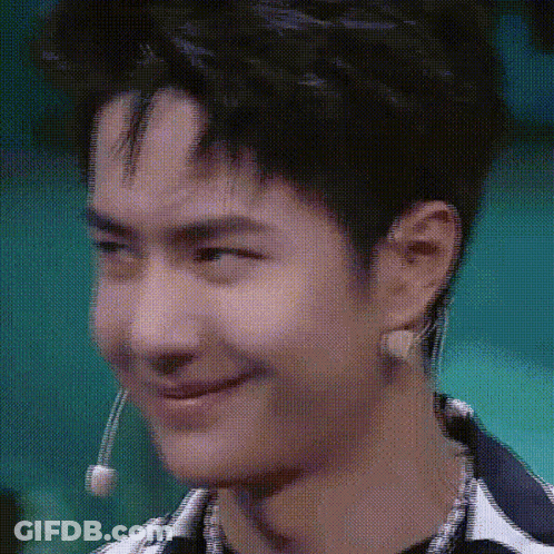 Young Man Making Funny Face With Microphone GIF