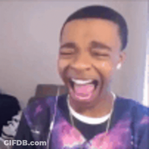 Young Man Making Funny Face With Tongue Out Wearing Headphones GIF