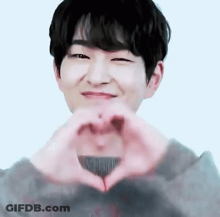 Young Man Making Heart Hands GIF