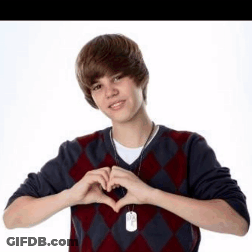 Young Man Making Heart Shape GIF
