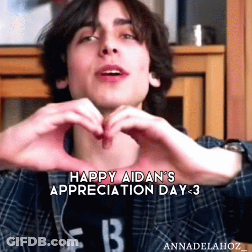 Young Man Making Heart Shape GIF