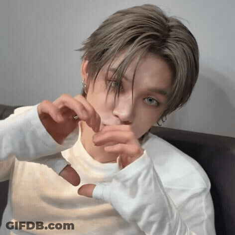Young Man Making Heart Shape With Hands GIF