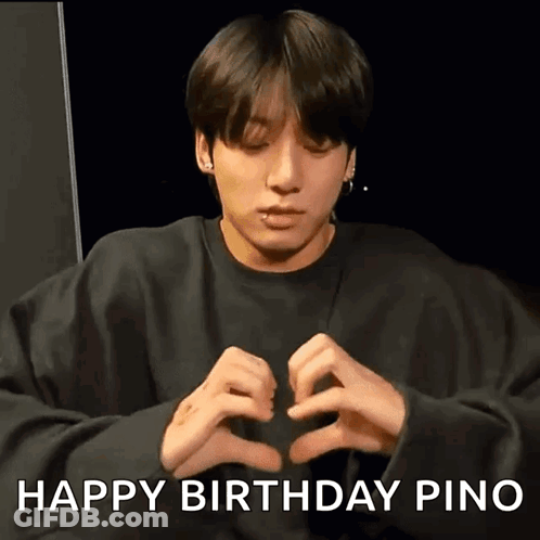Young Man Making Heart Shape With Hands In Black Sweatshirt GIF